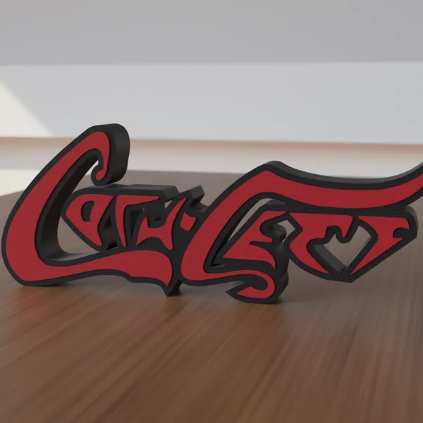 Freestanding 3D-printed script logo sign, front view, black body with red script, 300mm size, standing on a wooden table.
