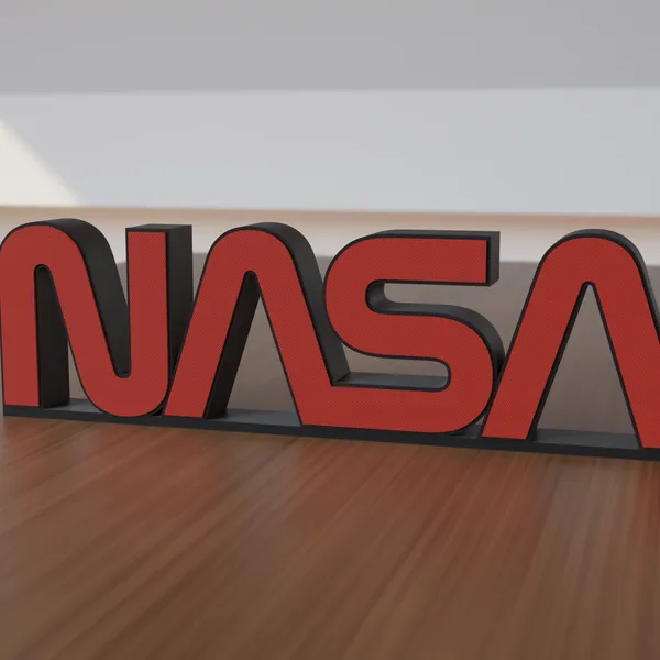Freestanding 3D-printed logo sign, front view, 300mm size, standing on a wooden table.