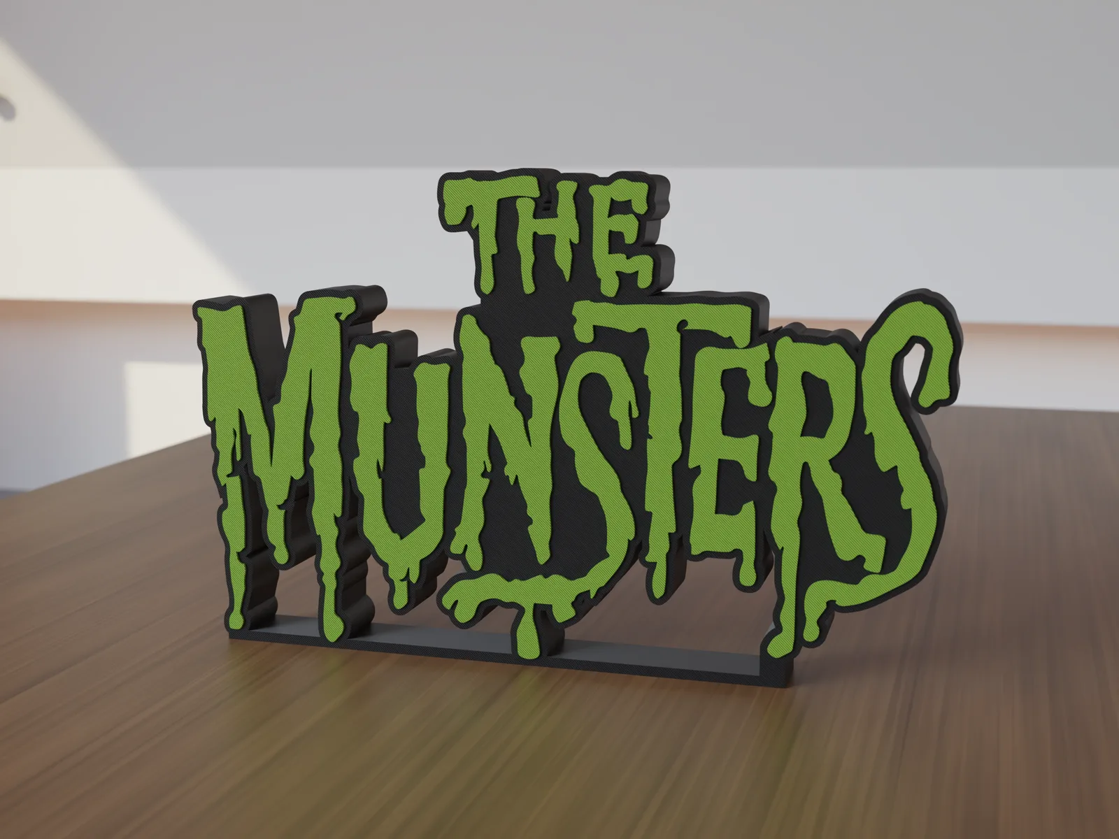 Freestanding 3D-printed logo sign, front view, 300mm size, standing on a wooden table.