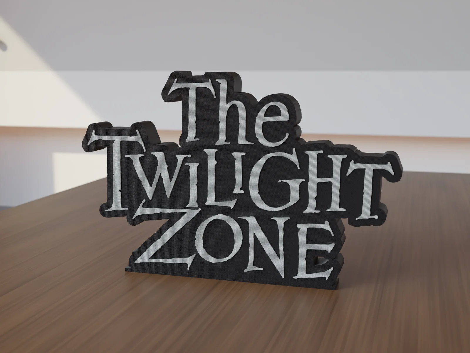 Freestanding 3D-printed logo sign, front view, 300mm size, standing on a wooden table.